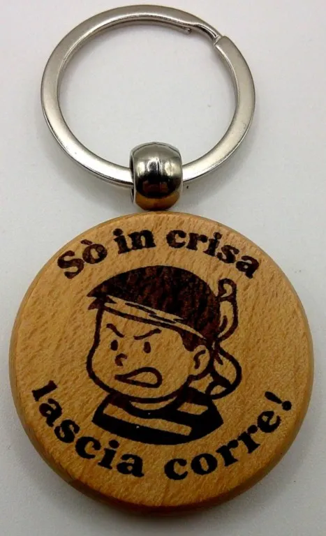 Porte-clés  corse So in crisa lascia corre garçonPorte-clés  So in crisa lascia corre garçon